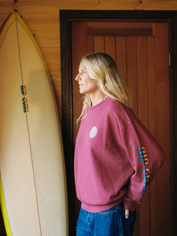 Stephanie Gilmore wearing a maroon Rip Curl jumper