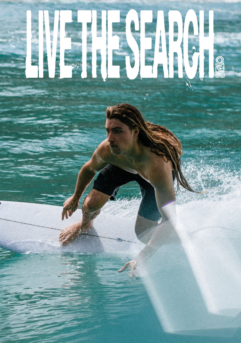 Person surfing with 'Live the Search' text overlay