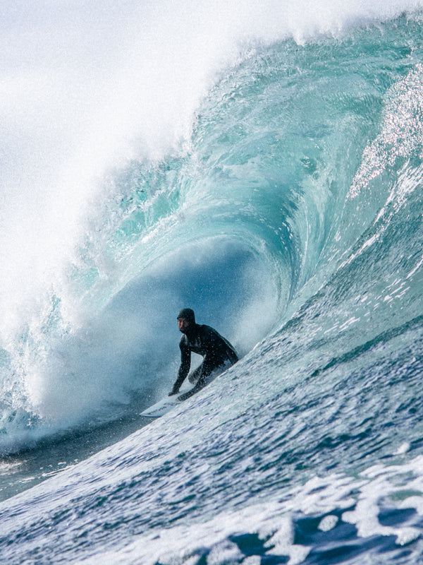 Rip Curl team member surfing in a barrel in Scotland