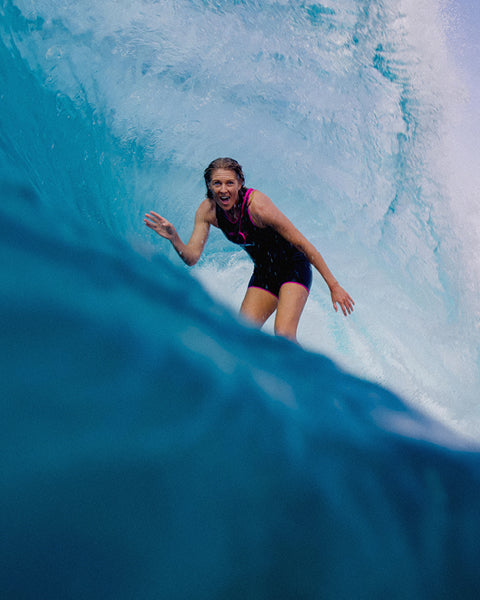 Person surfing inside a wave pool
