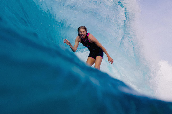 Person surfing inside a wave pool
