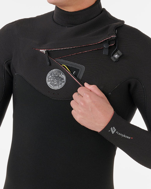 Person wearing a black wetsuit with a visible brand logo on a white background
